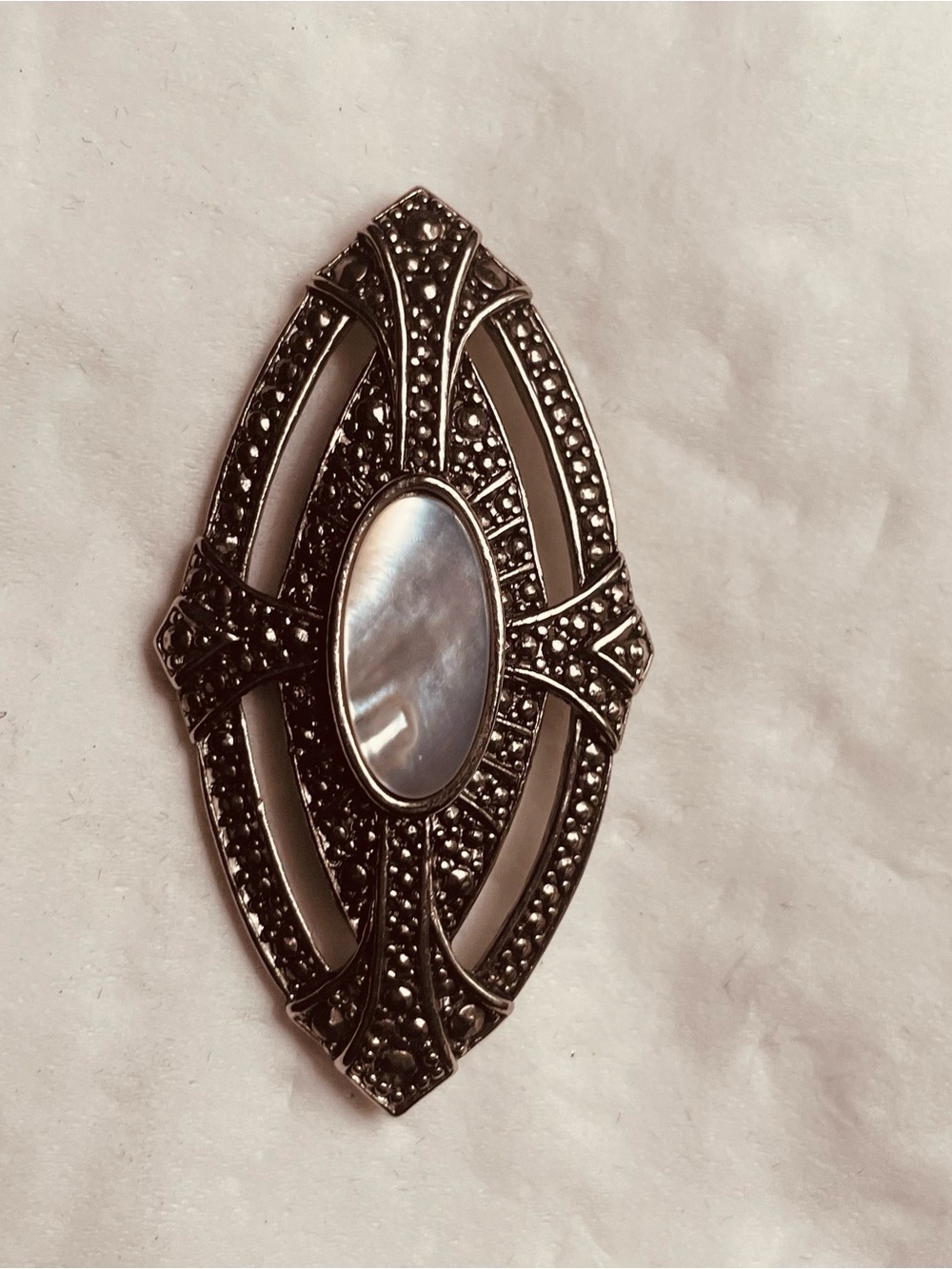 Avon Silver-Tone Marcasite and Mother-of-Pearl Oval Brooch